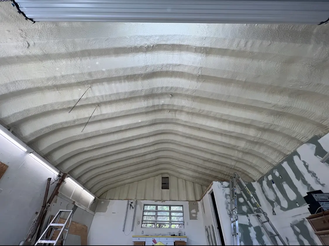 Spray polyurethane foam applied to the underside of a metal roof deck in Clarence